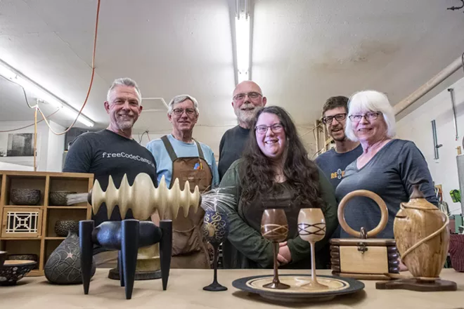 From left: Virgil Aurand, Ed Krumpe, Jim Christiansen, Amelia Trejo, Ben Carpenter and Stephanie Miller pose for a picture in front of a collection of wooden art that they’ve made as members of Palouse Woodworkers Collaborative. - ZACH WILKINSON/360