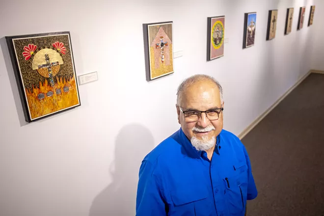 Ray Esparsen stands in front of his artwork for a portrait at the Lewis-Clark State Center for Arts & History exhibit as part of the Beautiful Downtown Lewiston's annual Artwalk. - AUGUST FRANK/360