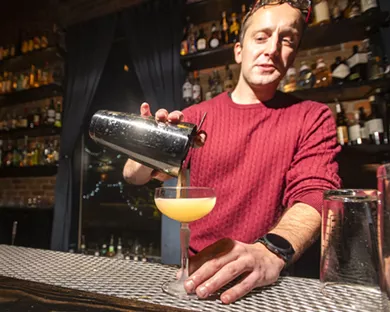 Head bartender John Leonardson makes a Captiva cocktail at Etsi Bravo in Pullman. - ZACH WILKINSON/INLAND 360