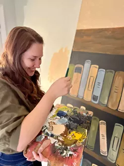Moscow Community Theatre volunteer Autumn Cole paints a panel for the set of "Sally Cotter and the Censored Stone," opening Friday (April 1) at the Kenworthy Performing Arts Centre. - COURTESY OF AUTUMN COLE