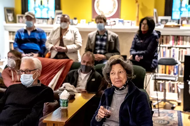 Attendees listen to the band Status/Non-Status performs in a home concert organized by Side Door last month in Pittsburgh. - ALEXANDRA WIMLEY/PITTSBURGH POST-GAZETTE VIA TNS