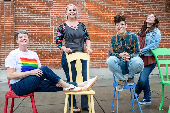 PFLAG committee members Kris Law, Meghan Pierce, Chelsea Cannard and Elisabeth Murillo, from left, gather for a photo on the corner of Fifth and D streets in downtown Lewiston. - AUSTIN JOHNSON/INLAND 360