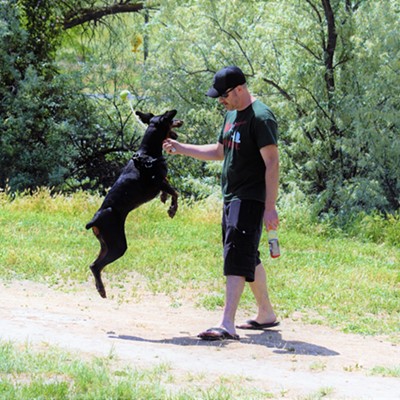 My son, Richard, and his dog, Mia, playing at the dog park in Clarkston. Taken June 2, 2017 by Mary Hayward of Clarkston.