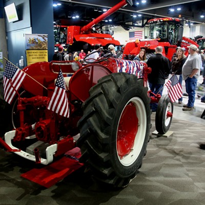 Patriotically 'camouflaged' tractor representing veterans in agriculture at the Spokane Ag Expo and Pacific NW Farm Forum. Picture taken Feb. 7, 2018 by Keith Collins.