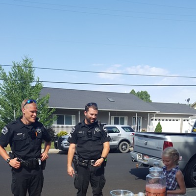On July 28 in Moscow, Deputy Sheriff Officers Mueller and Duke stop by the lemonade stand of Leila Rudzinis, 8, daughter of Jessie Thill and Jeremiah Rudzinis of Moscow. It is part of the PACT EMS Lights on Lemonade summer program.