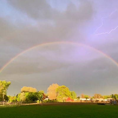 Photo of rainbow and lightning