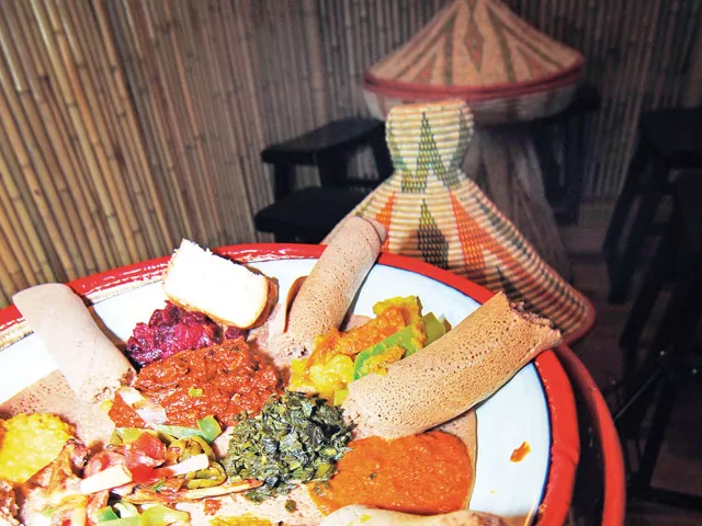 A communal dinner at Queen of Sheba - TAMMY MARSHALL