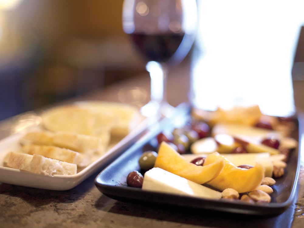 A five-cheese tray with a glass of cabernet at Mezzo Pazzo - MIKE MCCALL