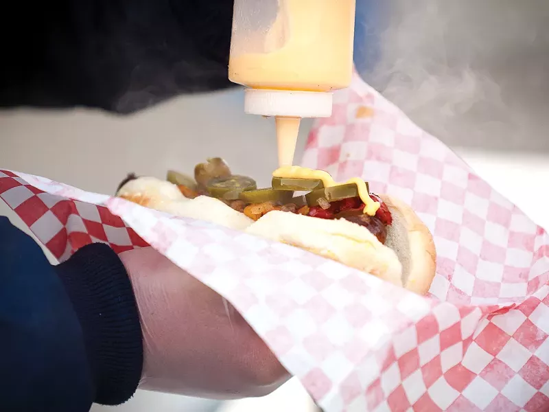 A German sausage with roasted sweet peppersand a cheddar cheese sauce - MIKE MCCALL