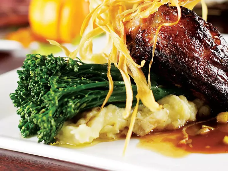 A grand cut grilled pork chop is on C.I. Shenanigan's Thanksgiving menu - YOUNG KWAK