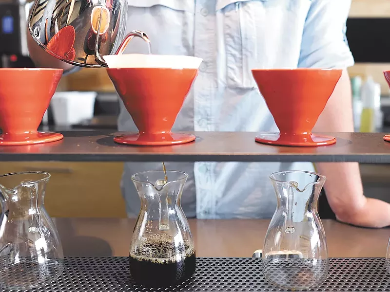 Aaron Monheim, a barista at Revel 77, makes a cup of coffee. - CHRISTIAN WILSON