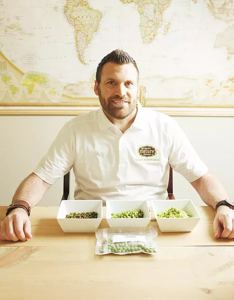 Aaron Sweatt of Fresh Nature Foods with a variety of garbanzo beans. - YOUNG KWAK