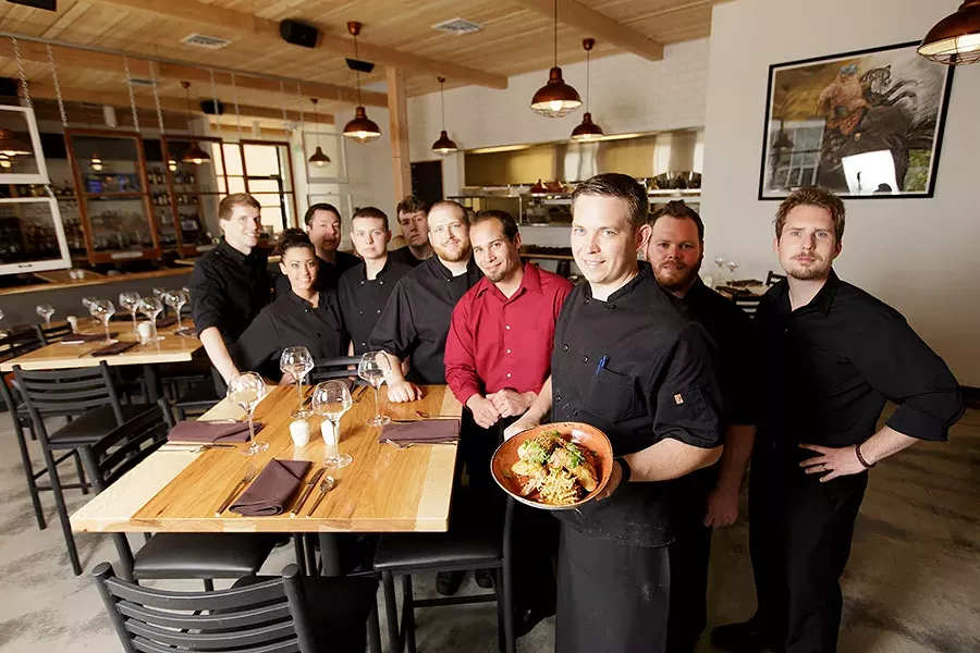 Adam Hegsted (front) as his Wandering Table staff, many of whom are his longtime friends and co-workers. - YOUNG KWAK