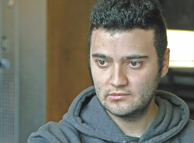 Adel Yafi, a 21-year-old student at Washington State University, once protested the Syrian regime. Now, he's watching the war from afar. - ANDREW BRADDOCK