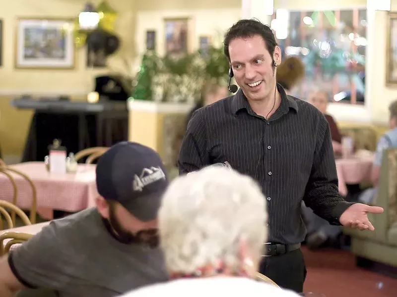 Adriano Ferraro singing "That's Amore" to diners - STEPHEN SCHLANGE