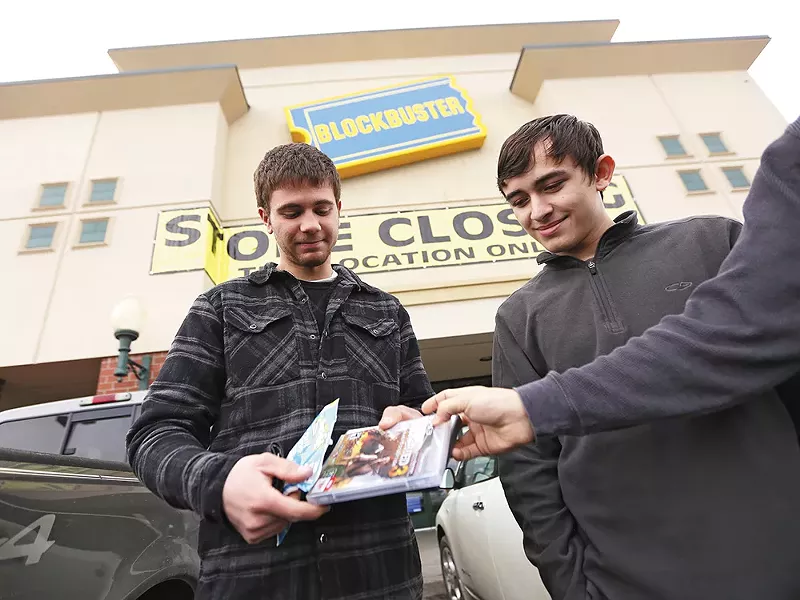 Anthony Schnettler, left, and Giovanni Soto outside of a closing Blockbuster in Cheney. - YOUNG KWAK