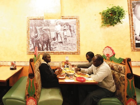 At Azteca Mexican Restaurant, Agwa and his daughter Abang order the Chile Colorado, which they say tastes similar to doro wat — considered the national dish of Ethiopia. - YOUNG KWAK