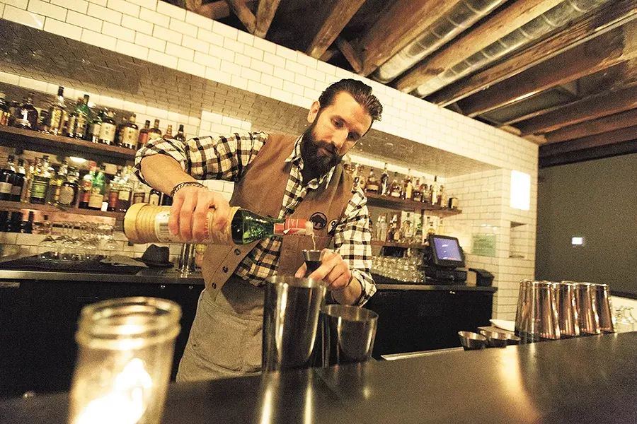 Bartender Ben Fife mixes up an Aviation cocktail. - YOUNG KWAK