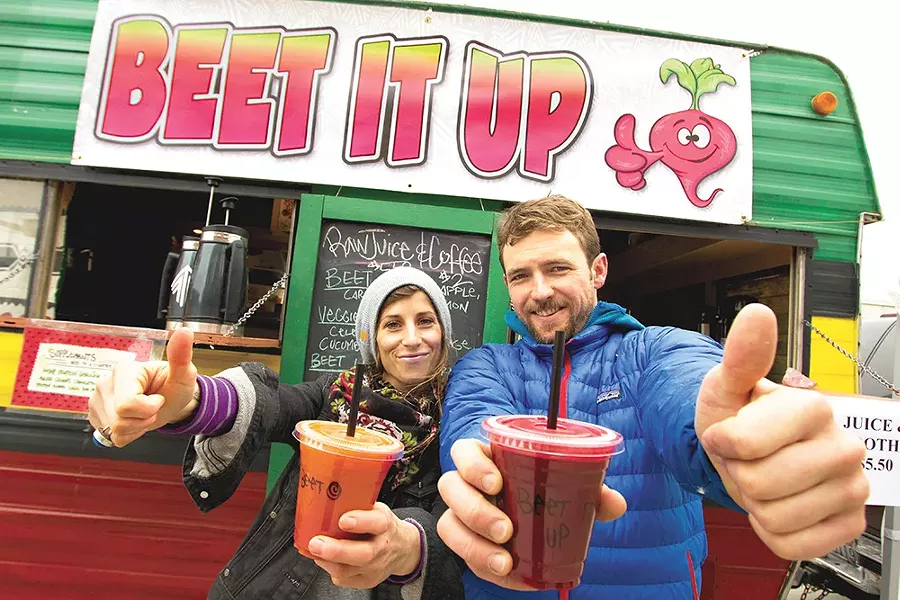 Brandi Elder and John Gardner with their newly opened juice truck. - JOE KONEK