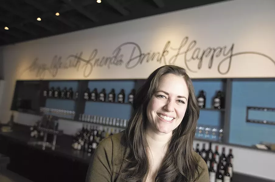 Brittany Stodgell in front of her mural at - Nectar Wine and Beer in Kendall Yards. - YOUNG KWAK