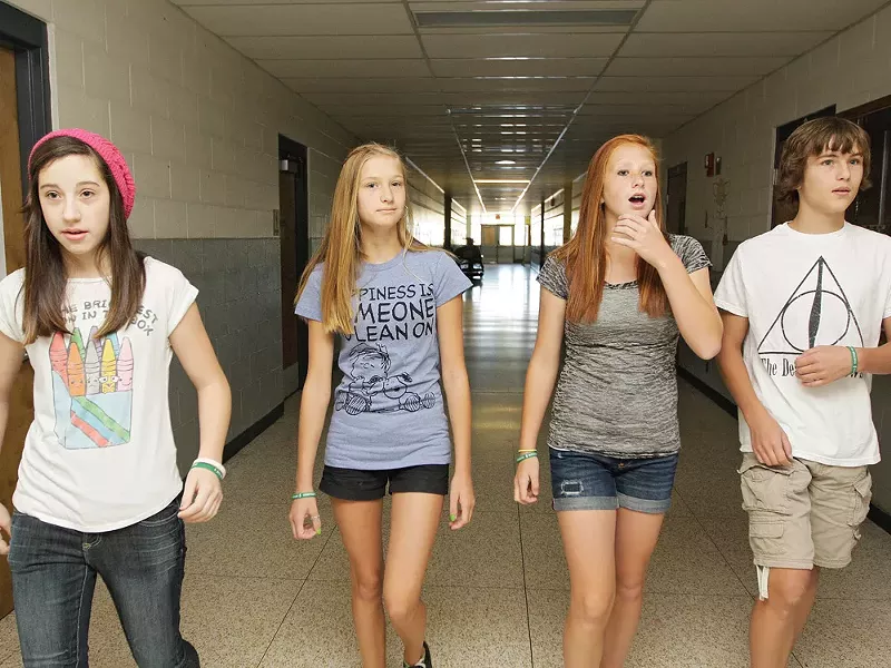 Brooklynn Juris (second from left) walking with her friends. She'll soon have a much longer walk to school. - YOUNG KWAK