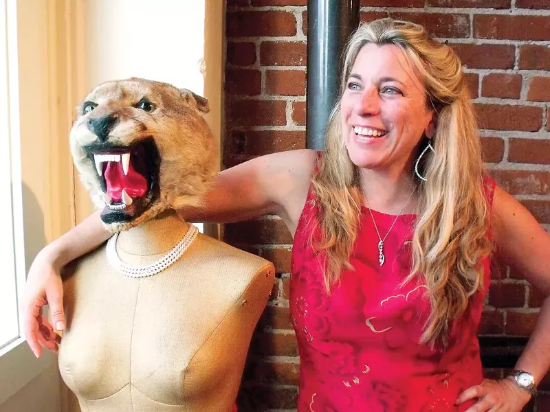 Carrie Scozzaro with her arm around "Den Mother." - HARLEY HIGHFILL PHOTOS