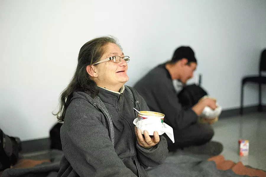 Carrol Ann Harvey-Brock and her husband enjoy soup at the family warming center. - YOUNG KWAK