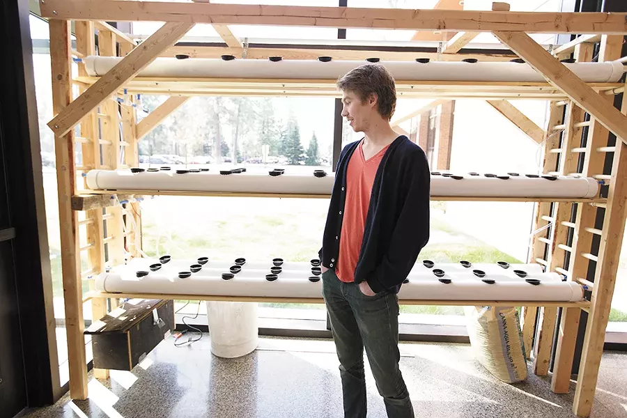 Chris Grochowski with a hydroponic system at Whitworth's Hixson Union Building. - YOUNG KWAK
