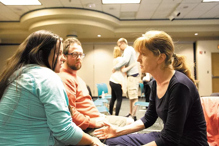 Clair Bennett counsels Amy Evans and Brian Rickey during a Childbirth Education Class. - YOUNG KWAK