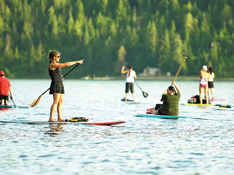 Coeur d\'Alene Paddle Board Co. owner Kym Murdoch, left, leads a class. - YOUNG KWAK