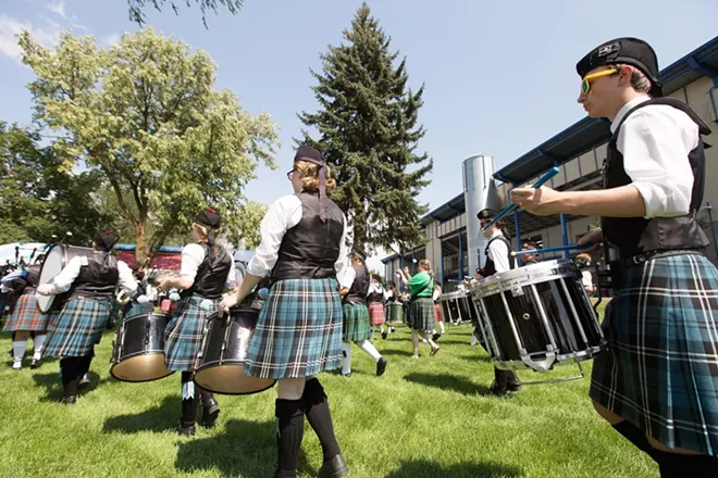 Columbia Regional Pipe Band member Chris Nickerson, right, performs during the opening ceremonies. - YOUNG KWAK