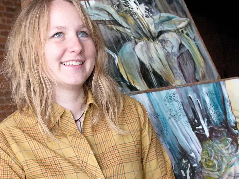 Cori McWilliams, with three paintings from “Lilly and the Dress” - AMY HUNTER