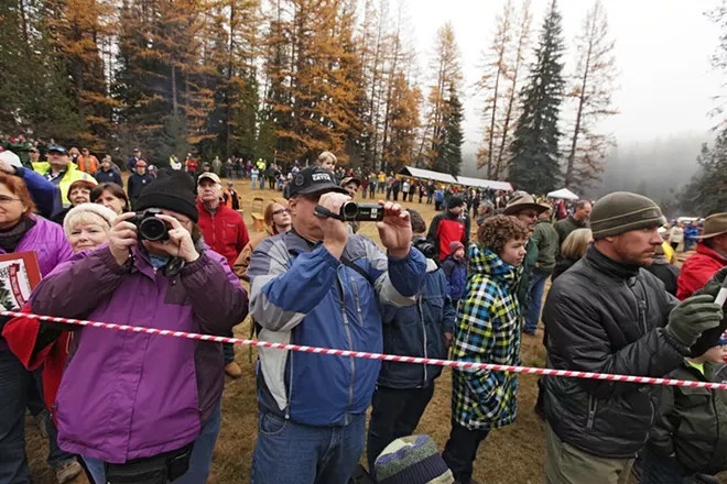 Debbie Lutz, left, and her husband Bob photograph and film during the cutting of an 88-foot Engelmann Spruce, destined to be the U.S. Capitol Christmas Tree. - YOUNG KWAK