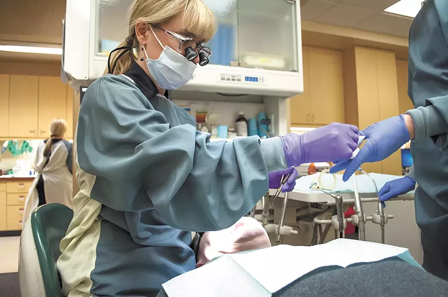 Dentist Elisabeth Warder (left) at the CHAS Denny Murphy Clinic. - SARAH WURTZ