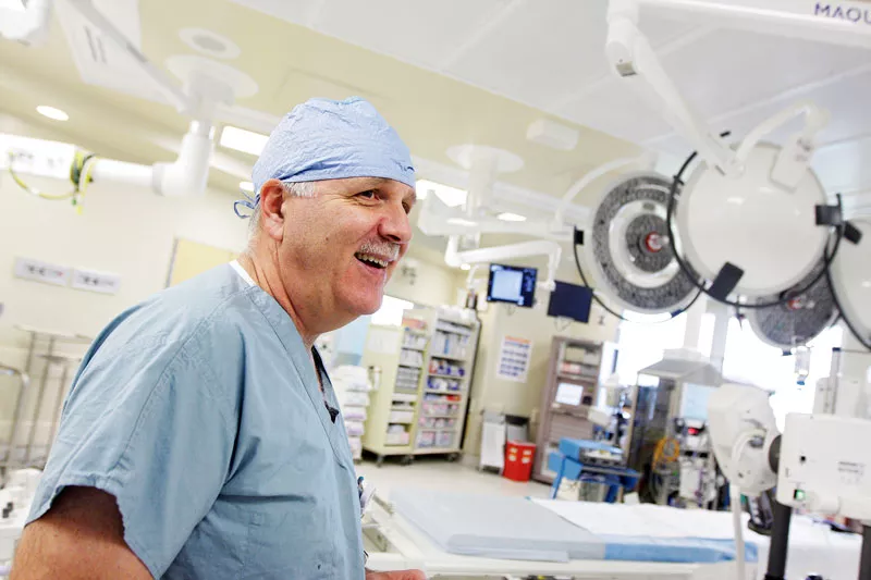 Dr. Michael Ring discusses the clinical trials that have him testing the MedTronic Corevalve in an operating room at Sacred Heart. - YOUNG KWAK