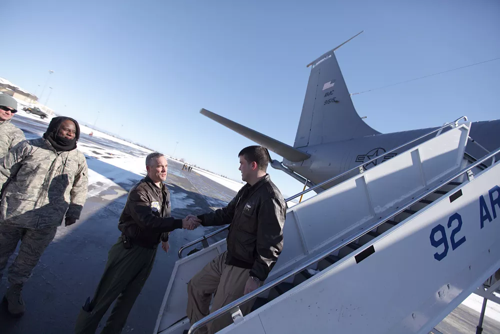 Fairchild Air Force Base commander Colonel Brian Newberry, left, greets 93rd ARS Major Steve Gant, who came back from a 2 1/2 month deployment at the Transit Center at Manas. - YOUNG KWAK