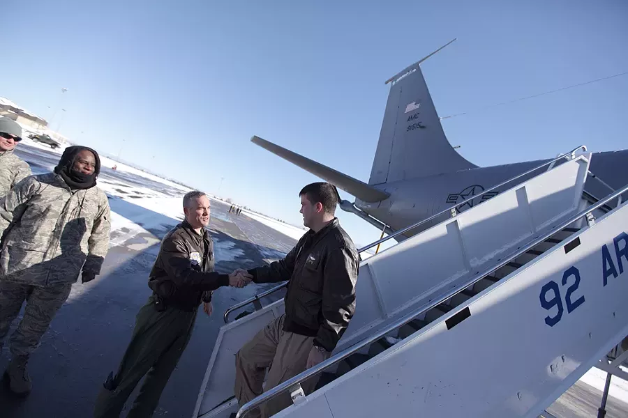 Fairchild Air Force Base commander Colonel Brian Newberry, left, greets 93rd ARS Major Steve Gant, who came back from a 2 1/2 month deployment at the Transit Center at Manas. - YOUNG KWAK