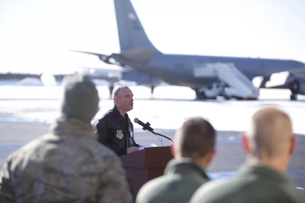 Fairchild Air Force Base commander Colonel Brian Newberry speaks with gathered personnel and family members before the final flights from the Transit Center. - YOUNG KWAK