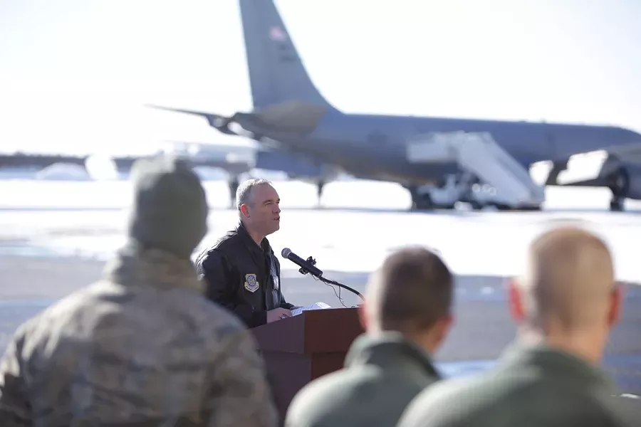 Fairchild Air Force Base commander Colonel Brian Newberry speaks with gathered personnel and family members before the final flights from the Transit Center. - YOUNG KWAK