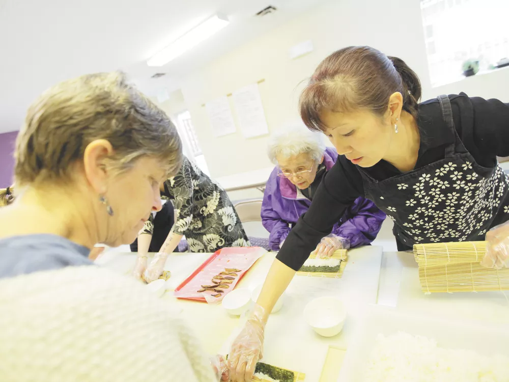 Fumi Uyeji, 87, applies her time-honed sushi-rolling skills at the Spokane Buddhist Temple. - YOUNG KWAK