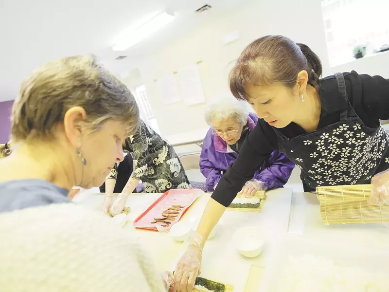 Fumi Uyeji, 87, applies her time-honed sushi-rolling skills at the Spokane Buddhist Temple. - YOUNG KWAK