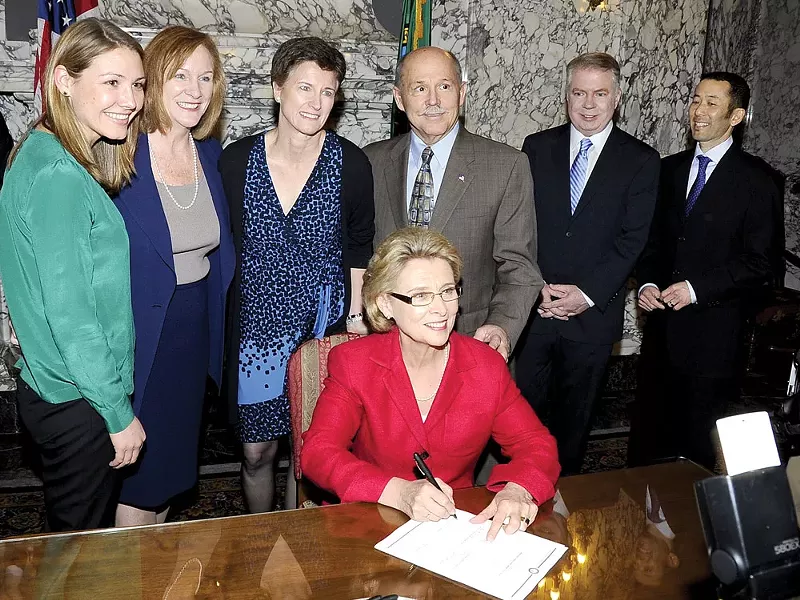 Gov. Christine Gregoire signs the gay-marriage bill Monday.