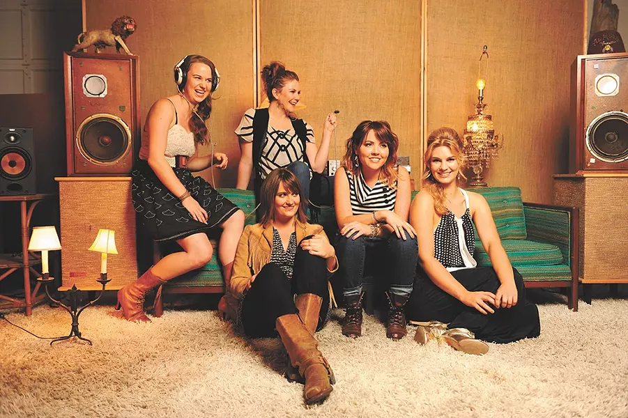 Grammy-nominated Della Mae, which features JayDean Ludiker’s daughter, Kimber (seated on the floor). - SARAH WURTZ