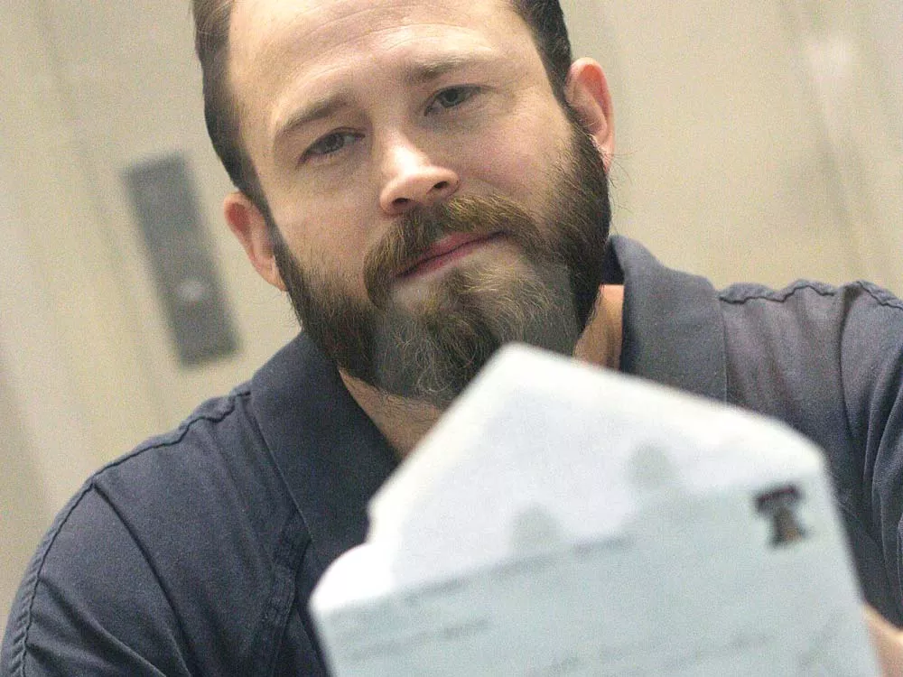 Inmate Rich Sullivan holds an undelivered letter he wrote to jail office supervisor Lynnette Brown at the jail last fall - YOUNG KWAK
