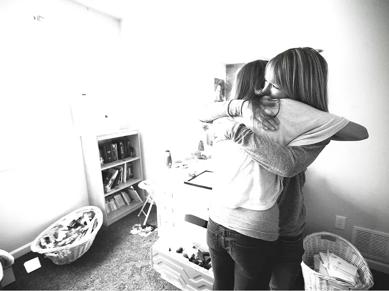 "It's weird not having a sister anymore," says Sydney Holliday, now 14, seen here with her mother. - YOUNG KWAK