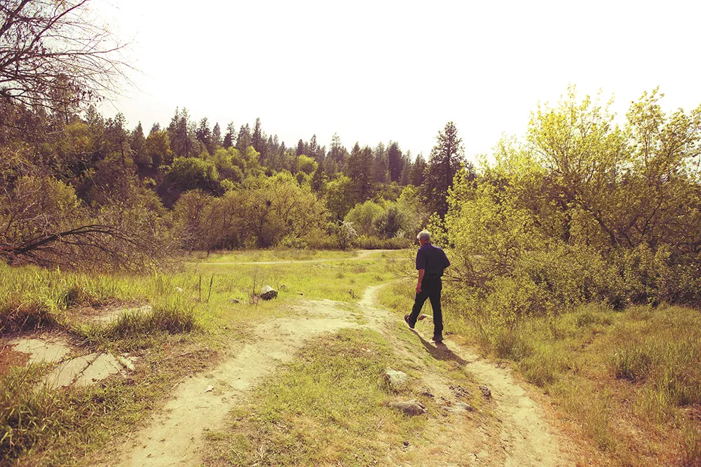 Jack Nisbet at People's Park; his subjects are generally within a day's drive of Spokane: "There's so much to explore right here." - YOUNG KWAK