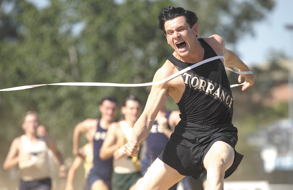 Jack O'Connell as real-life hero Louis Zamperini.