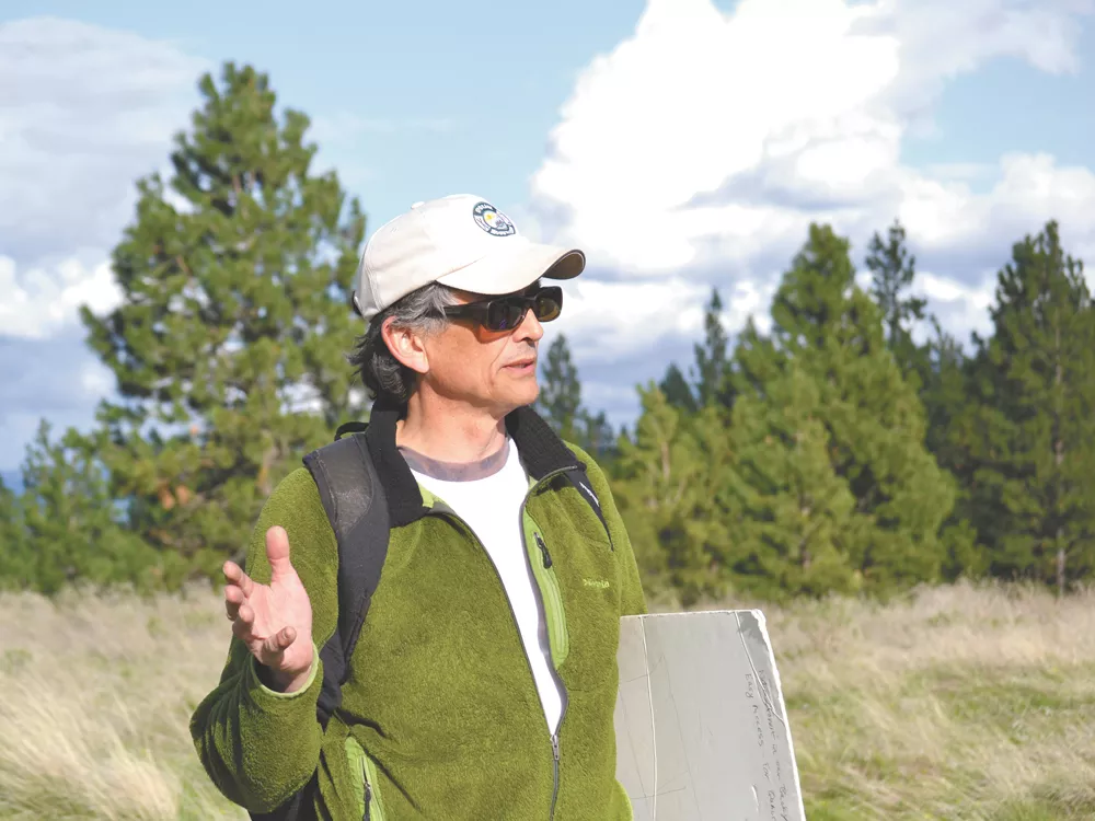 Jeff Lambert of the Dishman Hills Alliance describes the new land purchases from atop the Dream Trail. - TED S. MCGREGOR JR.