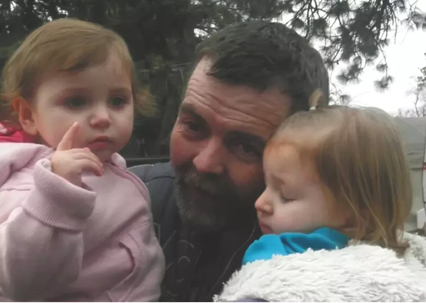 John Everitt with his granddaughters.