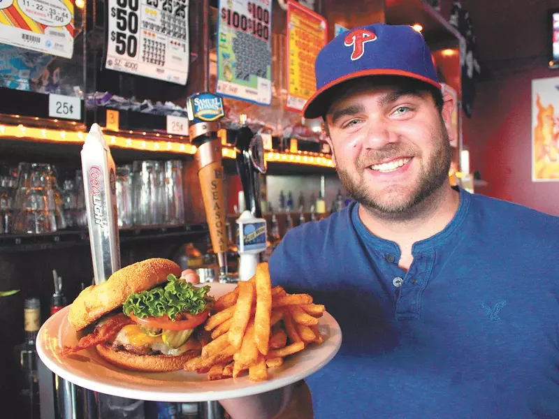 Johnny Oliveri shows off the Big Deezy burget at JJ\'s. - JOE KONEK